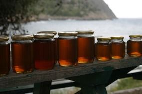 honey jars on a bench