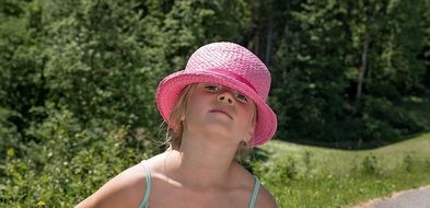 Little girl in a pink hat