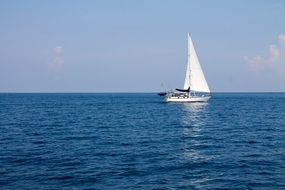 sailboat traveling in the sea