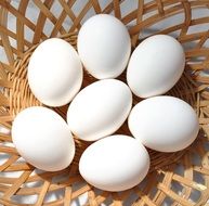 white eggs in a basket for a breakfast