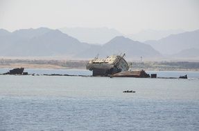 landscape of wrecked ship on the seashore
