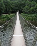 swinging footbridge over the river