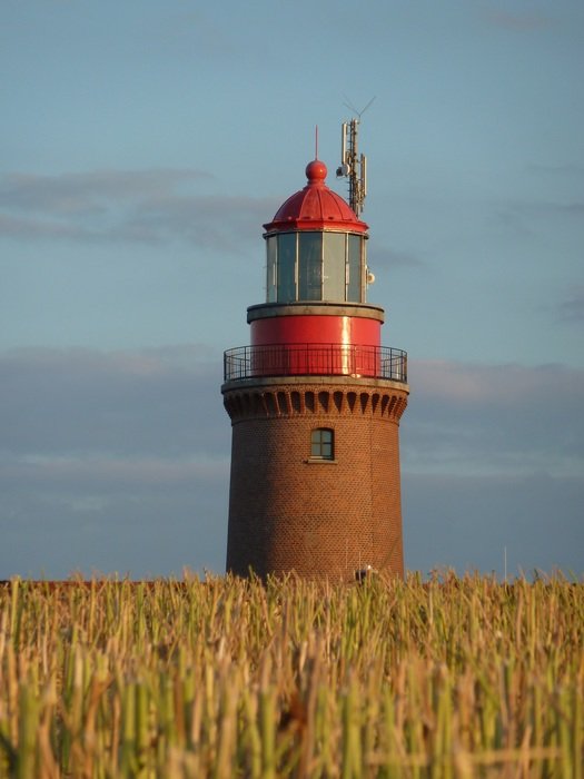 red lighthouse on the coast of the Baltic Sea