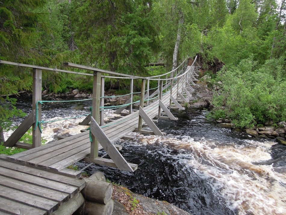 landscape of wooden bridge over the waterfall