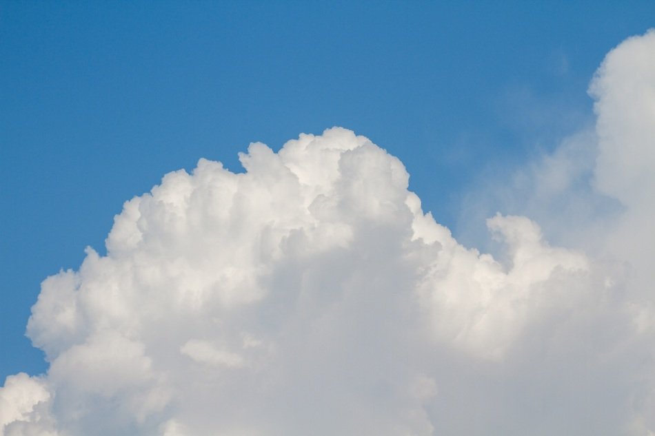Foam clouds in the blue sky