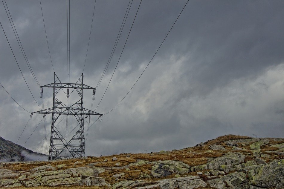 landscape of power pole in mountains in Switzerland