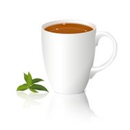 white cup of tea and leaves