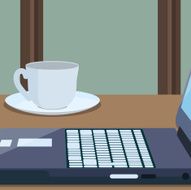 Workplace with a part of laptop and cup coffee