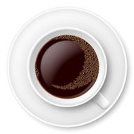 White mug of coffee with foam and saucer