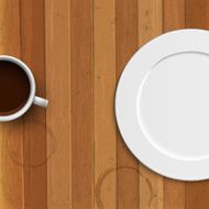 Dinner plate and coffee cup on wooden background