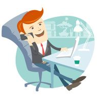 Office man sitting at his working desk with phone