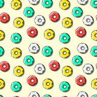 Seamless pattern of bright multi-colored donuts