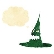 cartoon spooky witches hat with thought bubble