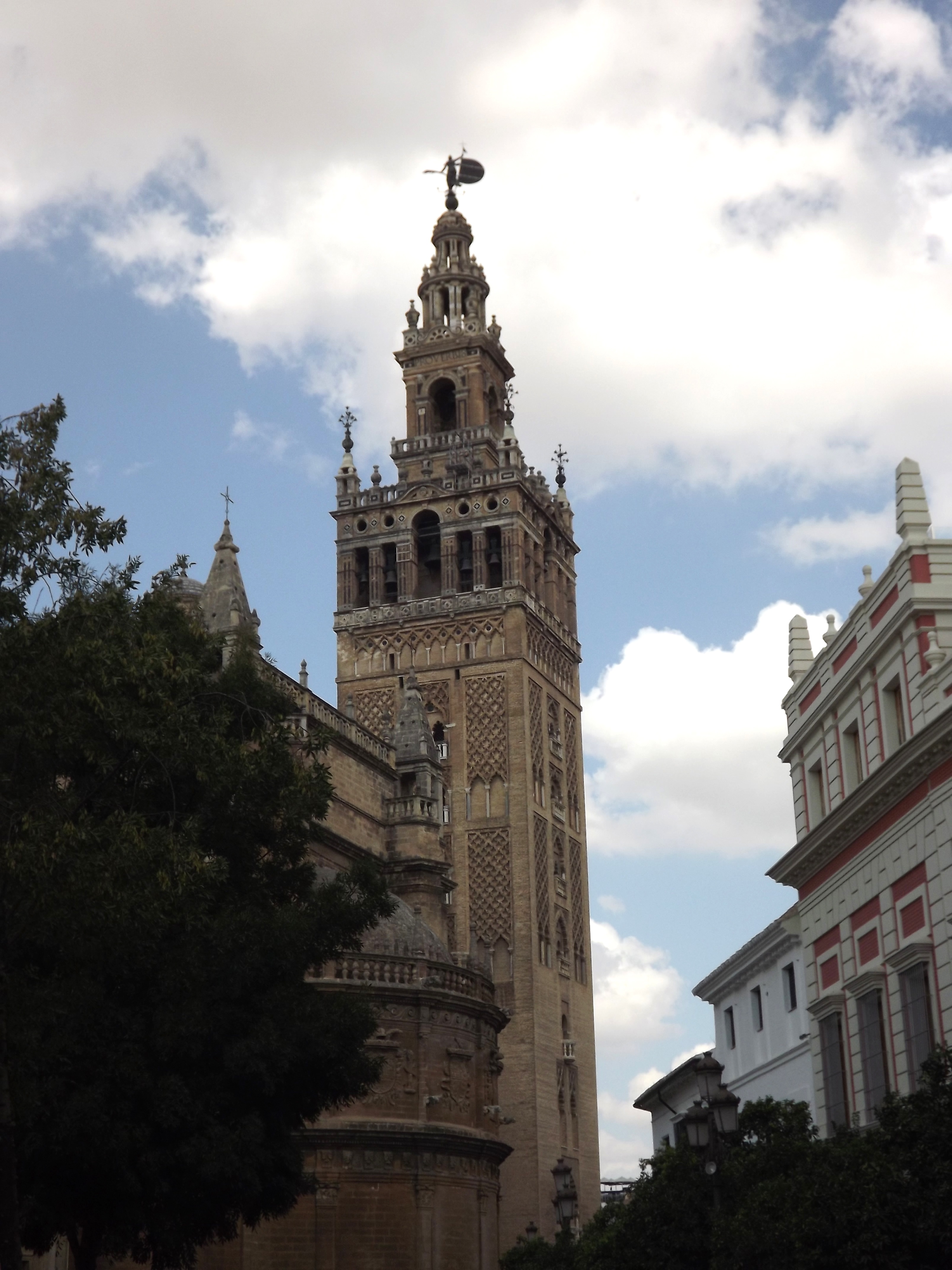 The Giralda Is The Bell Tower Of Seville Cathedral In Seville, Spain ...