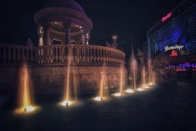 fountain near hotel in las vegas in night illumination