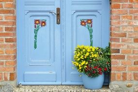 blue doors with pictures of flowers