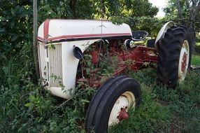 white tractor on green grass