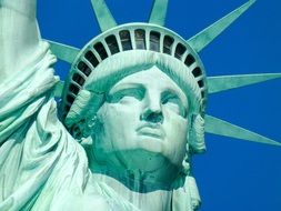 statue of liberty against the blue sky