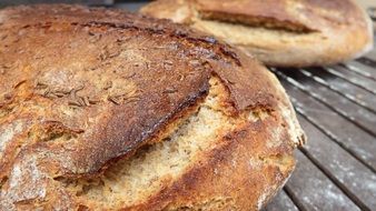 brown bread on a wire rack after baking