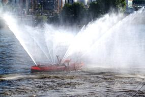 ship on the river with splashes of water