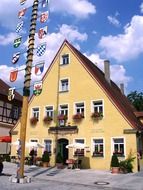 building with potted flowers on a window sill in Bavaria