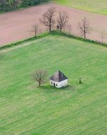 house among green field with grass
