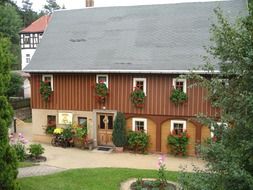 house with flowers on the windows