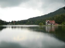 building on scenic lake shore, turkey, bolu