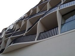 curved balconies on facade of modern building