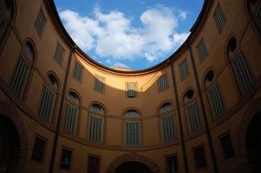 curved facade of historical building at sky