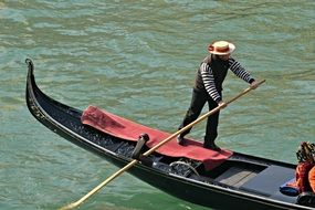 gondolier is on the gondola