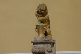 close up picture of the golden lion statuette