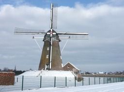 windmill at snowy winter, germany