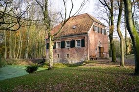 Old brick house in a autumn forest