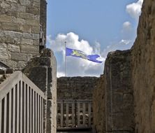 purple flag on a historical castle in Dordogne, France