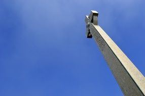 Stone cross monument sky scene