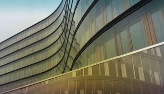 curved glass facade of modern building