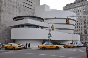 yellow taxis near the Guggenheim Museum in the usa