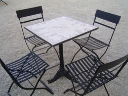 table with chairs in the street