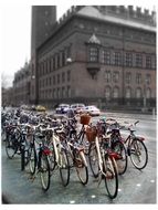 bicycles are parked at the town hall in Copenhagen