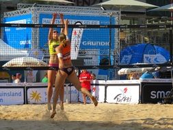 Players of beach volleyball