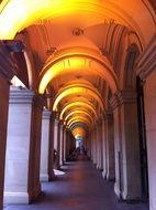 yellow light of arches in a historic building