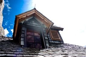 Roof of old building with a window