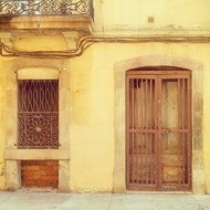 door and window on the facade of an old building