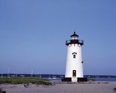 Tall lighthouse on the ocean coast