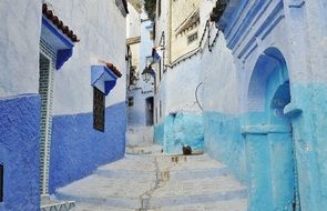 alley town old blue houses