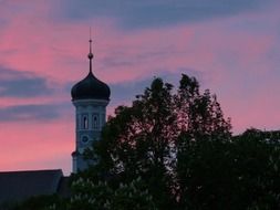 Bell tower of the church at sunset