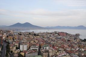 top view of city and mount vesuvius on seaside, italy, naples