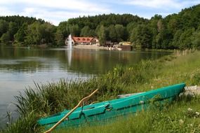 green boat by the pond among the plants in Zoland an der Spree, Germany