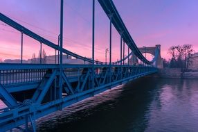 bridge over the river in lower silesia in the pink twilight